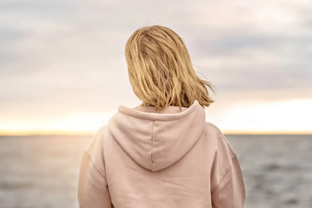 Person reflecting by the water during individual therapy support from Blue Shores Counselling in Collingwood and Stayner.